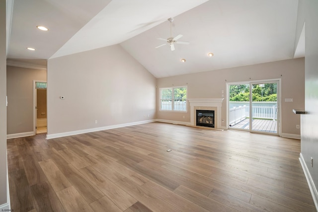 2 Clay Ct, Cape May, NJ 08204 - unfurnished living room featuring a ceiling fan, a glass covered fireplace, wood finished floors, high vaulted ceiling, and recessed lighting