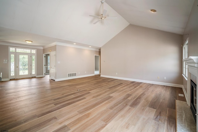 2 Clay Ct, Cape May, NJ 08204 - unfurnished living room featuring crown molding, a ceiling fan, a fireplace with flush hearth, vaulted ceiling, and light wood-style floors