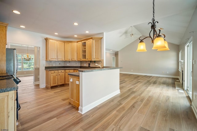 2 Clay Ct, Cape May, NJ 08204 - kitchen featuring a chandelier, black electric range, freestanding refrigerator, dark countertops, and light wood-style floors