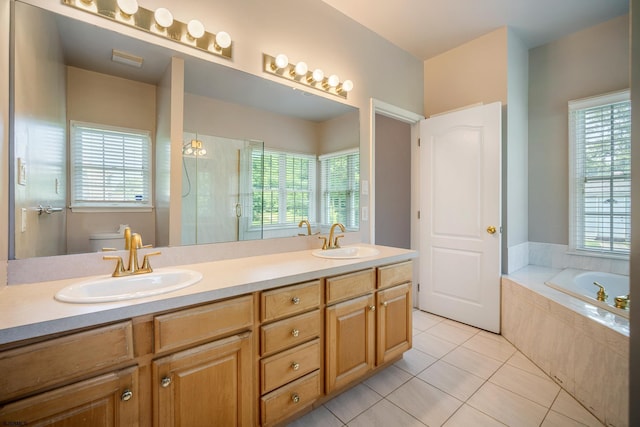 2 Clay Ct, Cape May, NJ 08204 - full bathroom with tile patterned floors, a stall shower, a garden tub, double vanity, and healthy amount of natural light