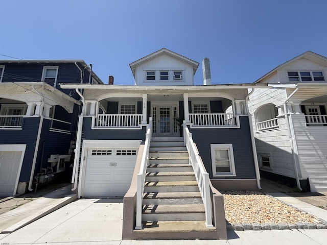16 N Nashville Ave, Ventnor, NJ 08406 - view of front of home with an attached garage, stairs, and concrete driveway