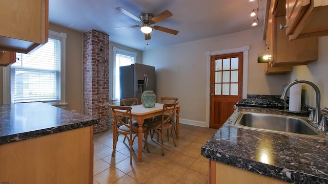 16 N Nashville Ave, Ventnor, NJ 08406 - kitchen with stainless steel fridge with ice dispenser, dark countertops, a ceiling fan, and light tile patterned floors
