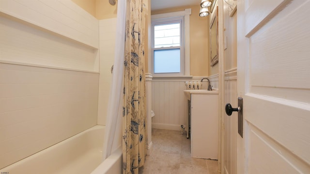 16 N Nashville Ave, Ventnor, NJ 08406 - bathroom with shower / bath combo, vanity, a wainscoted wall, and tile patterned floors