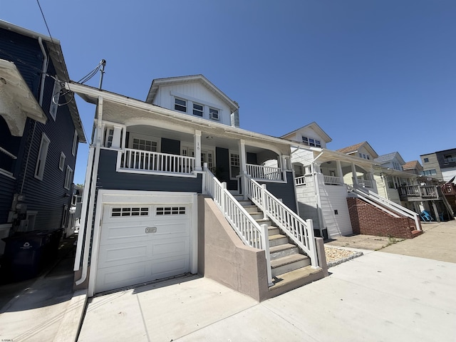 16 N Nashville Ave, Ventnor, NJ 08406 - view of front of home featuring stairs, an attached garage, and covered porch