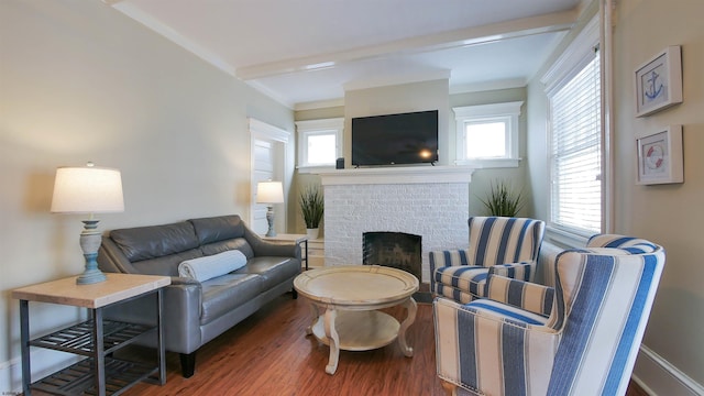 16 N Nashville Ave, Ventnor, NJ 08406 - living room with wood finished floors, a brick fireplace, and beamed ceiling