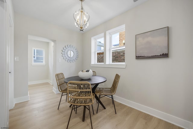 114 N Avolyn Ave, Ventnor, NJ 08406 - dining room featuring light wood finished floors, a chandelier, and healthy amount of natural light