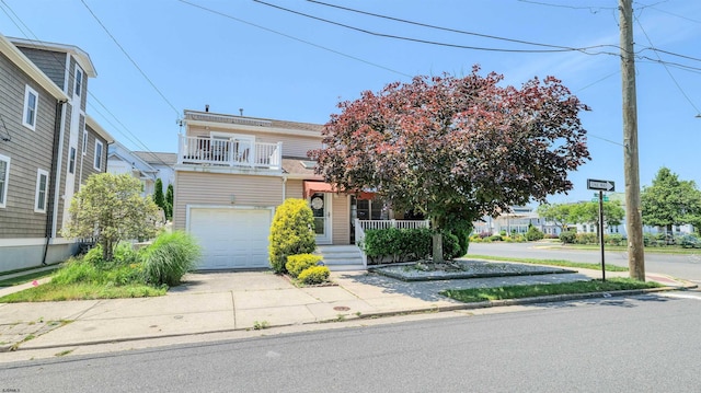 2 S Barclay Ave, Margate, NJ 08402 - view of front of house featuring an attached garage, concrete driveway, a porch, and a balcony
