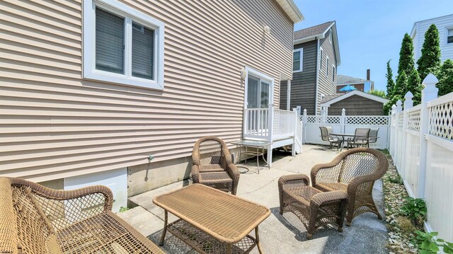 2 S Barclay Ave, Margate, NJ 08402 - fenced backyard with a patio area and outdoor dining space