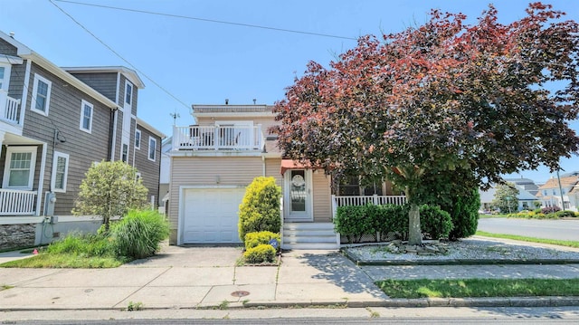 2 S Barclay Ave, Margate, NJ 08402 - view of front of property featuring a porch, an attached garage, driveway, and a balcony