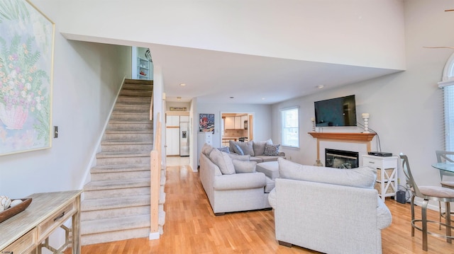 2 S Barclay Ave, Margate, NJ 08402 - living area featuring a glass covered fireplace, stairs, light wood finished floors, and recessed lighting