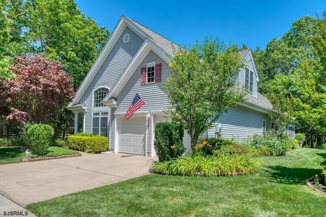 1 Poppy Rd, Egg Harbor Township, NJ 08234 - view of front of property with driveway, a front yard, and an attached garage