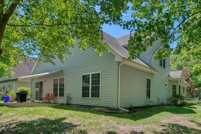 1 Poppy Rd, Egg Harbor Township, NJ 08234 - rear view of property featuring a patio, a lawn, and a shingled roof