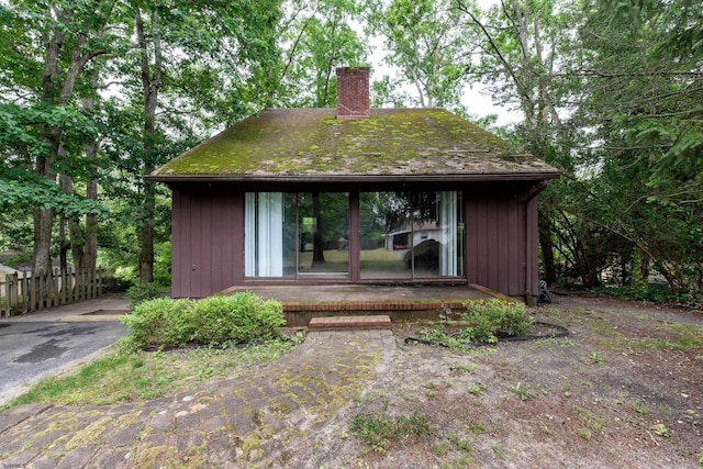 3821 Brookhaven Dr, Vineland, NJ 08361 - rear view of house featuring a chimney and board and batten siding