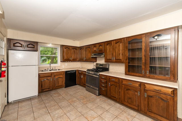 3821 Brookhaven Dr, Vineland, NJ 08361 - kitchen with freestanding refrigerator, stainless steel range with gas stovetop, dishwasher, under cabinet range hood, and light countertops