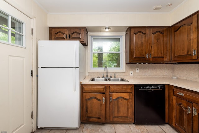 3821 Brookhaven Dr, Vineland, NJ 08361 - kitchen with freestanding refrigerator, black dishwasher, light countertops, tasteful backsplash, and crown molding