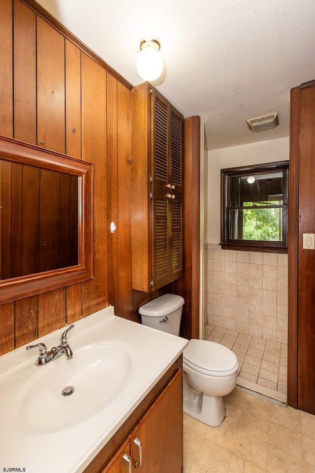 3821 Brookhaven Dr, Vineland, NJ 08361 - bathroom featuring vanity, tile walls, and a wainscoted wall