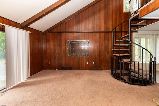 3821 Brookhaven Dr, Vineland, NJ 08361 - unfurnished living room with wood walls, carpet floors, beam ceiling, and high vaulted ceiling