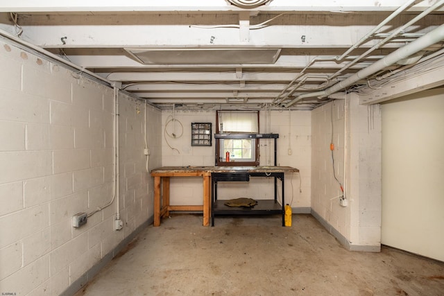 3821 Brookhaven Dr, Vineland, NJ 08361 - basement with a workshop area and concrete block wall