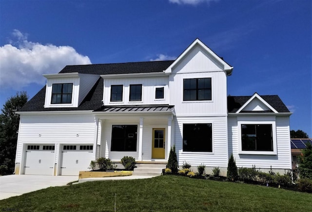 20 Monet Dr, Mays Landing, NJ 08330 - modern farmhouse style home featuring a front lawn, driveway, an attached garage, a shingled roof, and a standing seam roof
