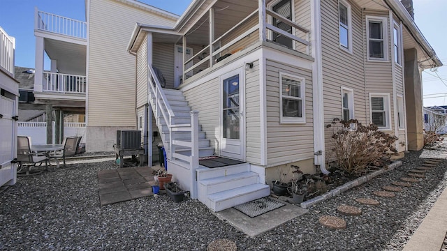 25 W 14th St Unit 1, Ocean City, NJ 08226 - view of property exterior with a central AC unit and stairway