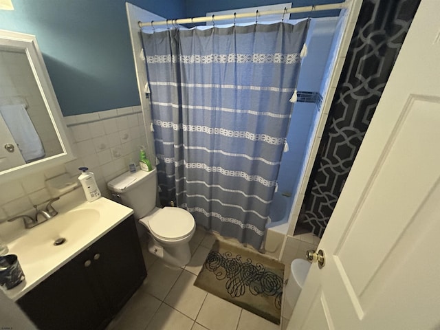 614 Caspian Ave, Atlantic City, NJ 08401 - full bathroom with tile patterned floors, vanity, shower / tub combo with curtain, tile walls, and wainscoting