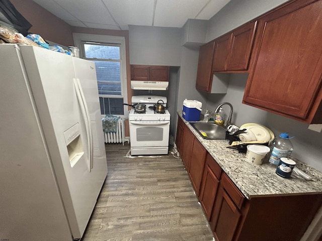 614 Caspian Ave, Atlantic City, NJ 08401 - kitchen with white appliances, under cabinet range hood, a drop ceiling, and wood finished floors