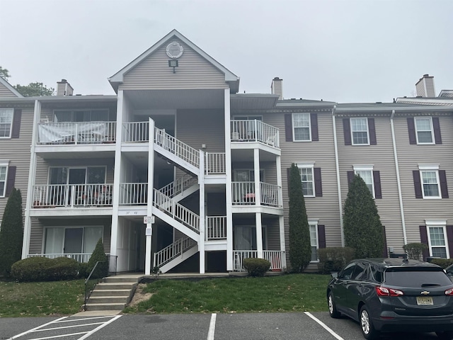 41 Arapaho Pl Unit 41, Galloway Township, NJ 08205 - view of building exterior featuring uncovered parking and stairs