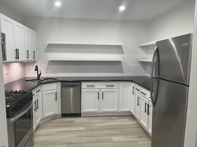 41 Arapaho Pl Unit 41, Galloway Township, NJ 08205 - kitchen with open shelves, stainless steel appliances, white cabinetry, dark countertops, and decorative backsplash