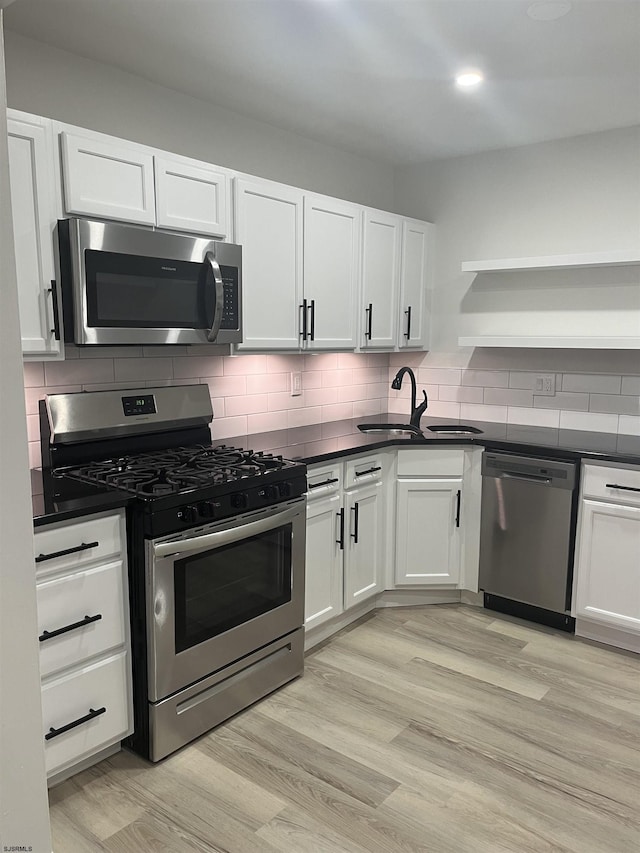 41 Arapaho Pl Unit 41, Galloway Township, NJ 08205 - kitchen with stainless steel appliances, open shelves, white cabinets, dark countertops, and recessed lighting