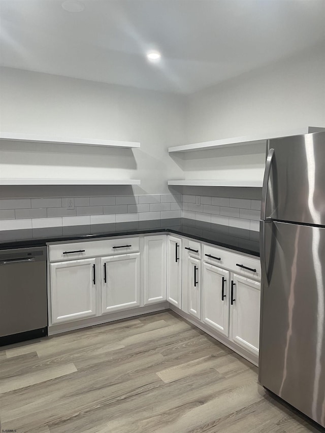 41 Arapaho Pl Unit 41, Galloway Township, NJ 08205 - kitchen with appliances with stainless steel finishes, open shelves, dark countertops, and white cabinets