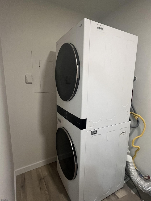 41 Arapaho Pl Unit 41, Galloway Township, NJ 08205 - washroom featuring stacked washer and clothes dryer and wood finished floors