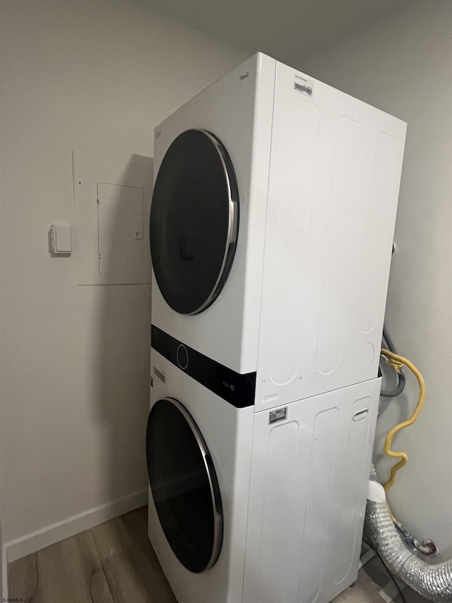 41 Arapaho Pl Unit 41, Galloway Township, NJ 08205 - laundry room with stacked washer and clothes dryer and wood finished floors