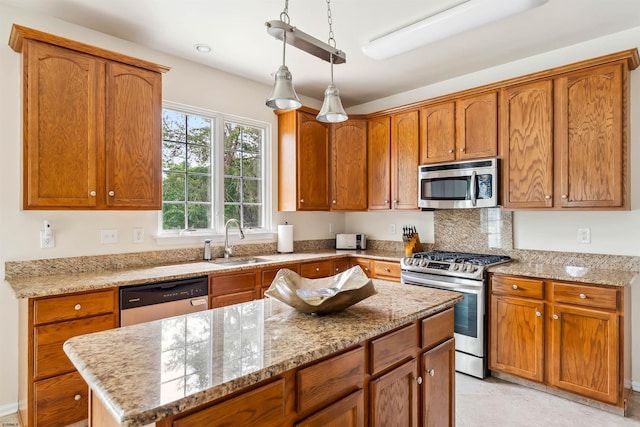 95 Knights Bridge Way, Mays Landing, NJ 08402 - kitchen with stainless steel appliances, light stone countertops, a kitchen island, and brown cabinets