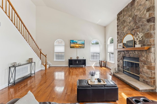 95 Knights Bridge Way, Mays Landing, NJ 08402 - living area featuring high vaulted ceiling, stairs, wood-type flooring, and a fireplace