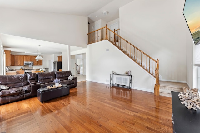 95 Knights Bridge Way, Mays Landing, NJ 08402 - living area featuring stairway, high vaulted ceiling, and light wood-style floors