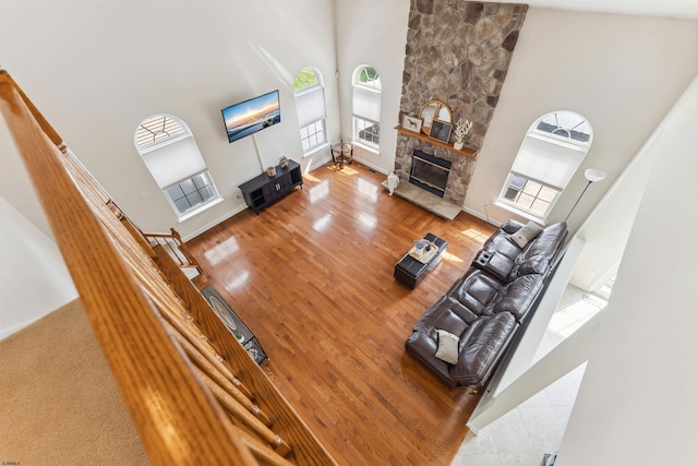 95 Knights Bridge Way, Mays Landing, NJ 08402 - living area with a towering ceiling, plenty of natural light, wood finished floors, and a fireplace