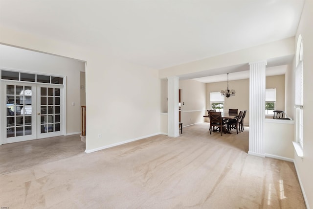 95 Knights Bridge Way, Mays Landing, NJ 08402 - empty room with carpet floors, a chandelier, and ornate columns