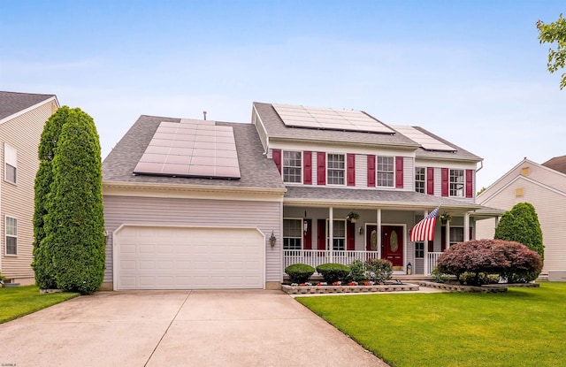 95 Knights Bridge Way, Mays Landing, NJ 08402 - view of front of property featuring covered porch, roof mounted solar panels, a front yard, concrete driveway, and a garage