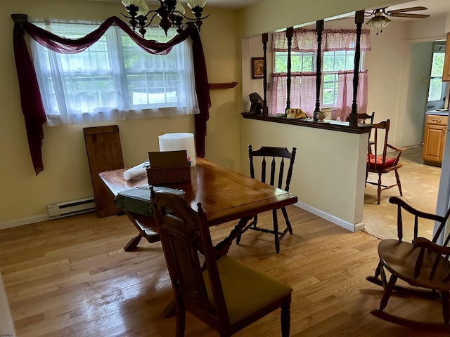 733 W Duerer St, Galloway Township, NJ 08215 - dining space with light wood-style flooring, a baseboard heating unit, a chandelier, and ceiling fan