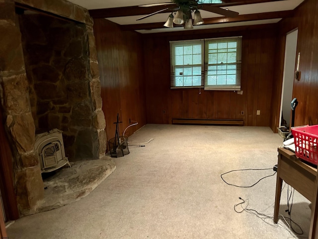 733 W Duerer St, Galloway Township, NJ 08215 - unfurnished living room with a baseboard radiator, a ceiling fan, carpet, a wood stove, and wood walls