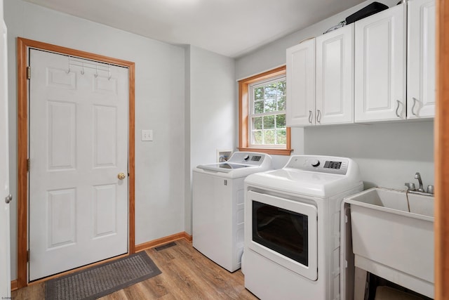 10 Hillside Ave, New Gretna, NJ 08087 - washroom featuring washing machine and clothes dryer, cabinet space, and light wood-style flooring
