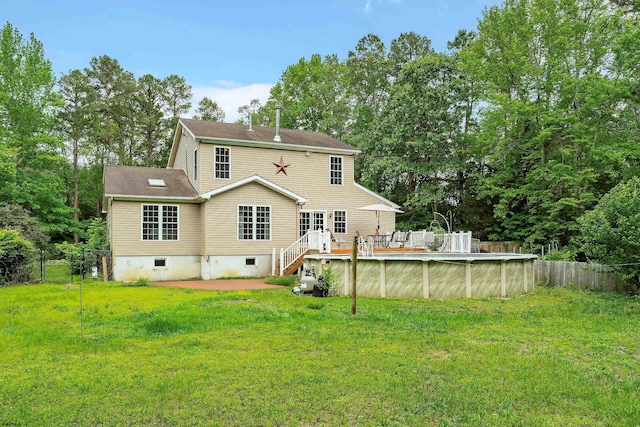10 Hillside Ave, New Gretna, NJ 08087 - back of property featuring an outdoor pool, view of scattered trees, a deck, and crawl space