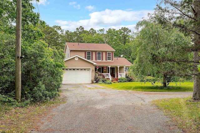 10 Hillside Ave, New Gretna, NJ 08087 - view of front facade featuring a porch, driveway, an attached garage, and a front lawn