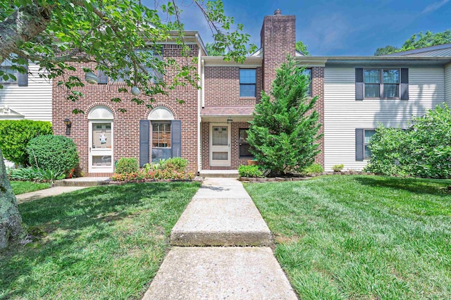 298 Mattix Run Unit 298, Galloway Township, NJ 08205 - townhome / multi-family property featuring brick siding, a front yard, and a chimney