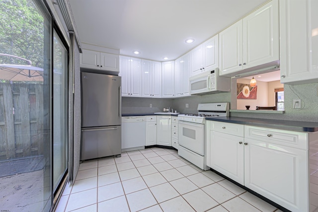 298 Mattix Run Unit 298, Galloway Township, NJ 08205 - kitchen featuring white appliances, white cabinets, dark countertops, light tile patterned flooring, and recessed lighting