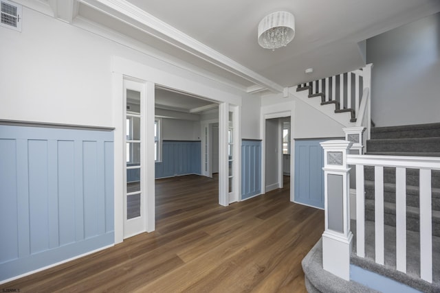 412 11th St Unit 2, Ocean City, NJ 08226 - staircase with wood finished floors, a wainscoted wall, a decorative wall, and beamed ceiling
