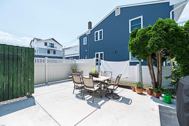 3801 Ocean Ave Unit 2, Brigantine, NJ 08203 - fenced backyard with a patio area, outdoor dining area, and grilling area