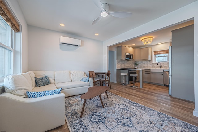 3801 Ocean Ave Unit 2, Brigantine, NJ 08203 - living area featuring a wall mounted AC, light wood-style flooring, recessed lighting, and a ceiling fan