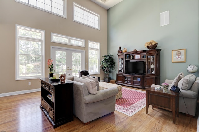 216 Castle Pine Dr, Egg Harbor Township, NJ 08234 - living area featuring a towering ceiling, light wood finished floors, and french doors