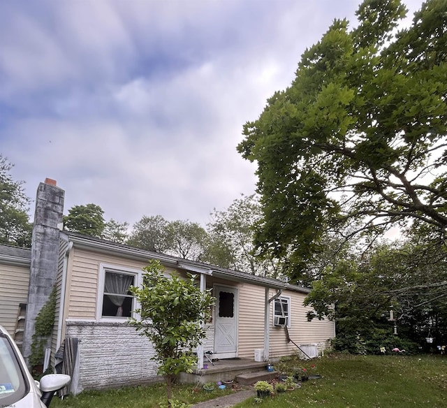 105 Lucille Dr, Egg Harbor Township, NJ 08234 - view of front of house featuring a chimney, cooling unit, and a front lawn